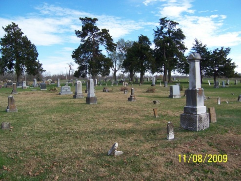 Cemetery grounds with chapel in distance