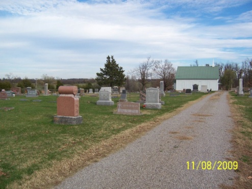 Older section of the cemetery with weathered headstones